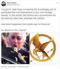 Observers joked about the superstar herself. Fans Compare Lady Gaga S Enormous Gold Brooch To The Hunger Games Mockingjay Pin Daily Mail Online