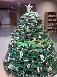 This christmas, people are building diy trees using everything from wine bottles to tree branches to cookie tins, but our inner bookworms are obsessed with these trees made out of stacks of novels. Library Christmas Trees Made Of Books And Bound Journals Christmas Tree Made Of Books Christmas Book Tree