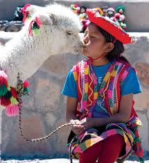 A Little Girl In Peruvian Traditional Clothing And A Bonus Kiss Peru Alpaca World Cultures