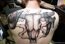 They usually features the skull and prominently displayed horns, sometimes combined with native american symbols like feathers. 71 Unique Bull Tattoos On Back