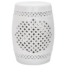 A white garden stool accent table sits beside a brown wicker lounger topped with a white cushion and blue pillows. Safavieh Quatrefoil White Ceramic Garden Stool Acs4506a The Home Depot