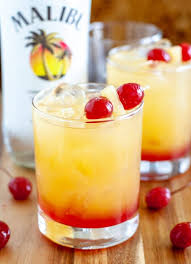 Malibu sangria recipe is a simple and perfect tropical drink for a summer day pool cocktail made with white wine, malibu rum, pineapple juice, and tropical frozen fruit like pineapple and mangos. Food Lovin Family Easy Family Friendly Recipes