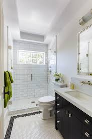 Accent wall tiles can add a nice touch to a bathroom and they can create the illusion that the bathroom has been updated. Black Washstand With White Hex Tiles Transitional Bathroom