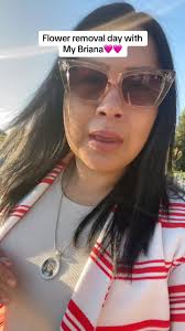Lady Removing Flowers from Mercedes Texas Cemetery Ebony Groves from  Mercedes Cemetery