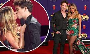 Addison Rae and Tanner Buchanan lock lips while presenting Best Kiss at the  MTV Movie & TV Awards