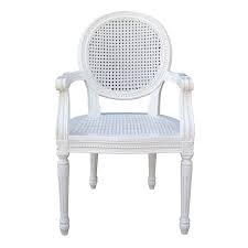 An eclectic style that harbors no firm do's and don'ts, french country style reads like a love letter to the french countryside. French Chateau White Rattan Dining Bedroom Arm Chair Furniture La Maison Chic Luxury Interiors