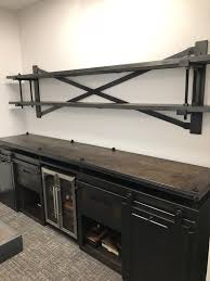 The Brockton Wall Unit Features A Steel Body Wood Top Wood Drawers And Steel Rolling Doors This Unit Can Wall Unit Garage Wall Storage Easy Garage Storage