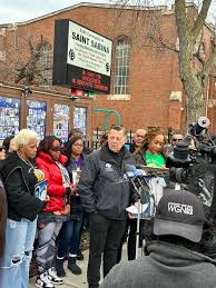 Father Michael Pfleger added a...