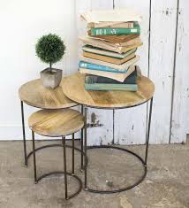 A play on contrast and proportion, super thick solid acacia wood top sits low to floor on skinny antique bronze legs. Iron And Mango Wood Top Nesting Tables Set Of 3 Vivaterra