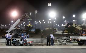 Grosjean's car hit a barrier that ripped it into two, and then burst into flames. Bahrain Gp Red Flagged After Romain Grosjean S Harrowing Crash