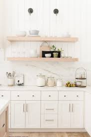 For areas not exposed to too much moisture or heat, adding shiplap on the backplash instead of using stone gives it a bit more. Marble And Shiplap Kitchen Backsplash Transitional Kitchen