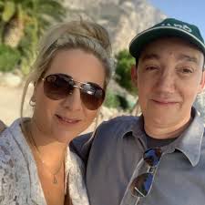 Please animate and make the guys turn to each other and handshake or hug.