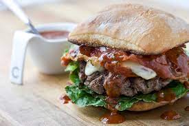 Greek beef burgers with tzatziki sauce — the most perfect burger to celebrate national beef burger day! Curtis Stone Italian Style Gourmet Burger