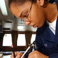 A fuel guideline is dragged in with the aid of a broom then pulled by hand  and secured to the USS Pearl Harbor (LSD-52) to begin refuel operations  during Exercise KERNEL BLITZ '
