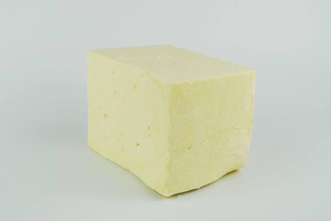 A block of traditional, crumbly Wensleydale cheese, AI generated
