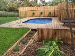 Above Ground Pool With Over Hanging Spotted Gum Deck And Curved Spotted Gum Coping To Hide The Deck Construction Decks Around Pools Building A Deck Diy Deck