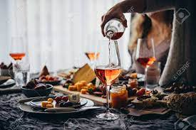 311 free images of dinner party. Pouring Rose Wine At A Dinner Party With Friends Stock Photo Picture And Royalty Free Image Image 133413696