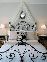 Wrought iron window grilles next to wrought iron bed ideas alongside valance ideas and grey bedding. Wrought Iron Bed Mediterranean Decor Bed Decor Iron Mediterranean Wrought Paris Themed Bedroom Wrought Iron Bed Bedroom Themes