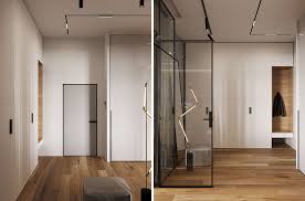 The house exterior design features wood and natural stone elements that decorate a small inner courtyar enclosed to create a wonderful place to relax and enjoy sunny days. A Glass Wall Separates The Living Room From The Home Office In This Modern Loft Apartment