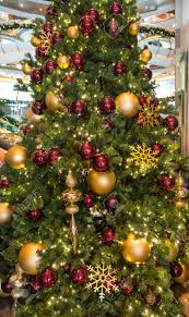 Browse through our selection of gold wedding christmas tree decorations for your home this year. Many Red And Gold Ornaments On A Green Christmas Tree Stock Photo Picture And Royalty Free Image Image 33150984