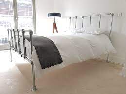 Lift the 2×6 side rail and slide the bed rail bracket claws into the slots so they lock in place. Diy Industrial Bed With Headboard And Footboard Simplified Building