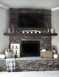 A gallery featuring a number of luxurious rustic and contemporary living rooms, all with beautifully built stone fireplaces. 50 Sensational Stone Fireplaces To Warm Your Senses