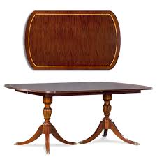 The six legs are carves and have feet with brass tip claws. Duncan Phyfe Dining Table Two Pedestals Jansen Furniture