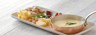 Primi piatti di pesce veloci. Fonduta Di Formaggio Asiago Con Polenta Saporie