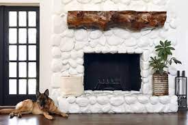 Fairy fireplace with river rock front, fireplace accessories and wood pile, woodland fireplace. Friday Finds Weekly Recap River Rock Fireplaces Rock Fireplaces Painted Rock Fireplaces