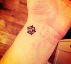 Hawaiian Flower Tattoo On Wrist Google Search Flower Wrist Tattoos Hawaiian Tattoo Simple Hand Tattoos