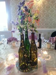 Pin By Ashley Mifflin On So Cute I Could Barf Wine Bottle Wedding Centerpieces Wine Bottle Centerpieces Wedding Wine Bottles
