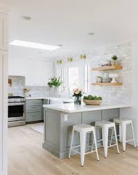 White up top with a wooden island and other splashes of wood textures keep it feeling light and airy. 10 Stunning Grey And White Kitchen Design Ideas Decoholic