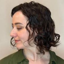 Not everyone wants layers, but blunt cuts don't always translate for wavy  hair. Baby graduation and a few face hugging pieces make this stark shape  work for my beautiful, mod-loving client. Find