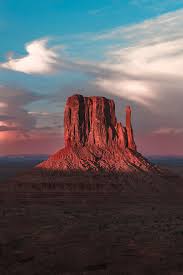 Visitors who take sunrise or sunset tour should do enough preparation to keep warm. Sunset At Monument Valley Photograph By Larry Marshall