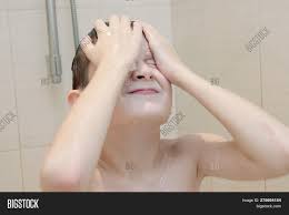 A boy taking an outdoor shower. Hygienic Procedures Image Photo Free Trial Bigstock