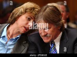 Robert Loux, executive director of the Nevada Agency for Nuclear Projects,  listens to Allison MacFarlane, a Massachusetts Institute of Technology  research assistant,