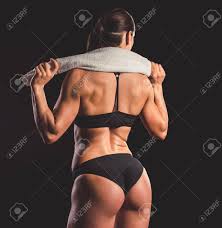 In addition, some women with larger amounts of muscle mass choose to take steroids to help. Back View Of Beautiful Strong Muscular Woman In Black Underwear Holding A Towel On Dark Background Stock Photo Picture And Royalty Free Image Image 73417573