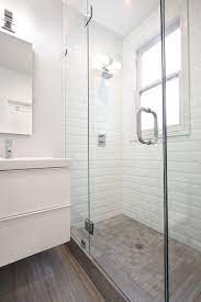 A small bathroom calls for light, neutral tiles like traditional white or cream. Beveled White Subway Tile With Grey Floor Nerland Sf Bathroom Remodel Photos Bathrooms Remodel Bathroom Wall Tile