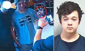 Wisconsin prosecutors add curfew charge against rittenhouse. Kenosha Shooter Kyle Rittenhouse Flashes White Power Signs While Posing For Photos In Bar Daily Mail Online