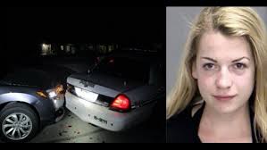 Police: Woman rams squad car while taking topless selfie