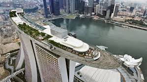 Hotel rooms feature one king or two queen beds and beautiful decor with a modern rustic design. Moshie Safdie On Singapore Architecture Cnn Travel