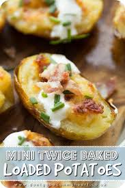 These Mini Twice Baked Potatoes Are Loaded With Bacon And Served With Sour Cream And Fresh Chives Say Hello To Your New Twice Baked Potatoes Food Baked Potato