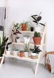 The copper pipes are fitted together to create a rectangular stand. 17 Diy Plant Pots And Stands That Ll Get You Ready For Spring