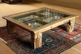 The table top is an antique reclaimed window, while the rest of the table box and legs are all made from very old reclaimed barn wood. Ocean Wood Treasure Table By Cassian Garbett Driftwood Driftwood Furniture Coffee Table Design Coffee Table