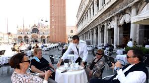 Photos show staff in personal protective equipment sanitizing a restaurant kitchen to conform with the new health and safety guidelines. As Officials Talk Of Tighter Lockdown Italian Restaurants Open Their Doors In Protest Videos Rt World News
