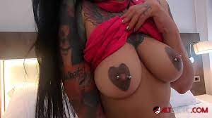 Beautiful brunette with tattoos and big tits sucks a big dick 