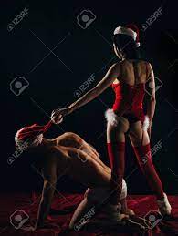 Christmas Sexy Party. Slavery Concept. Dominant Girl In Santa Hat. BDSM  Games With Domination And Submission. Stock Photo, Picture And Royalty Free  Image. Image 135629020.