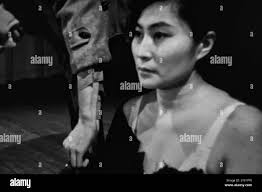 Yoko ono cut piece hi-res stock photography and images