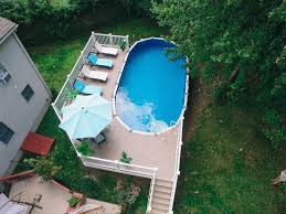 Backyard Paradise With Paradis Pools In 2020 Above Ground Pool Landscaping Backyard Pool Landscaping Pool Landscaping