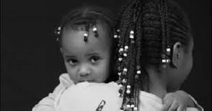 Photographers take portraits of Flint kids, their families